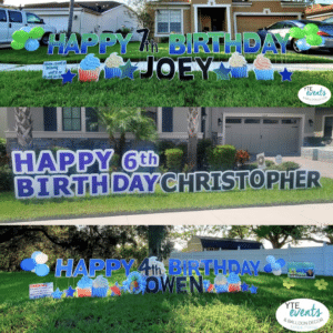 A colorful and customized "Happy Birthday" yard card display featuring vibrant balloons, stars, and personalized name, set up in a yard in Tampa.