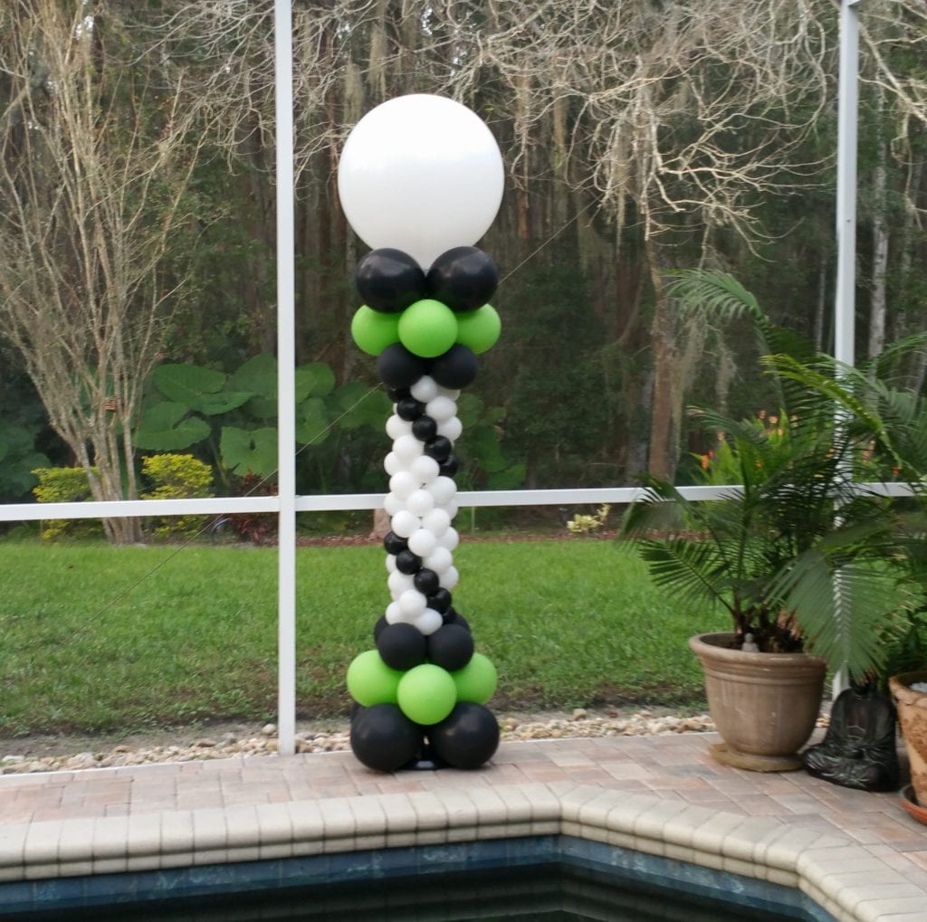 green and black balloon column by the pool