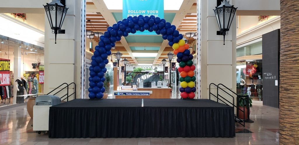 Balloon Arch back to school event at westshore mall blue and primary colors