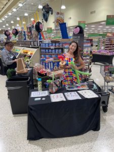 tina's balloon twisting setup is ready for boars head event at publix grocery store