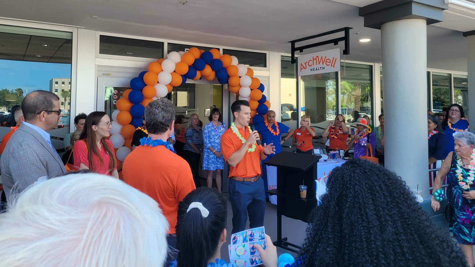 grand opening archwell entrance orange blue white balloon arch
