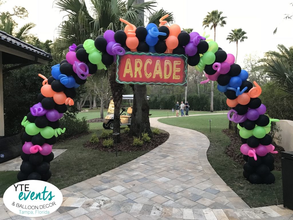 Arcade Themed neon arch for event with curly ques and fun