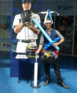 balloon hat and balloon sword with balloon artist at Rays Baseball Game