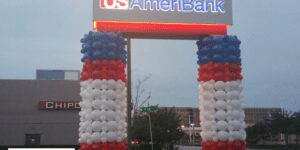 Balloon column sculptures to compliment a sign for a branch of US AmeriBank.