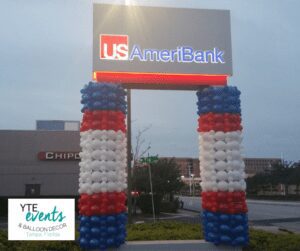 Balloon column sculptures to compliment a sign for a branch of US AmeriBank.