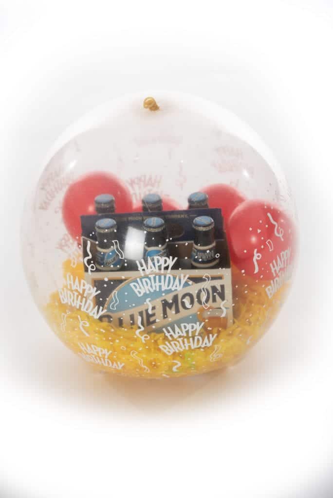 Balloon stuffed with 6 pack of beer for delivery scaled e1607381052307