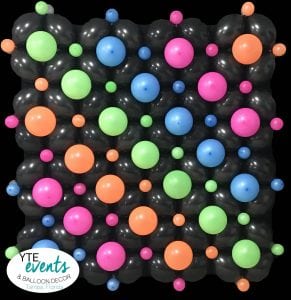 Balloon wall with neaon color decorations in neon rainbow design