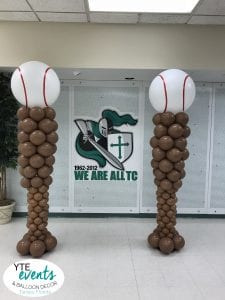 Baseball column sculptures with baseball toppers and bat bases