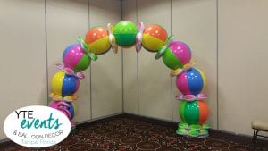 Beach ball themed balloon arch for event