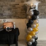 Black gold and silver balloon columns scaled