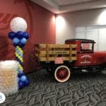 Budweiser corporate event with beer mug sculpture and balloon column and truck scaled