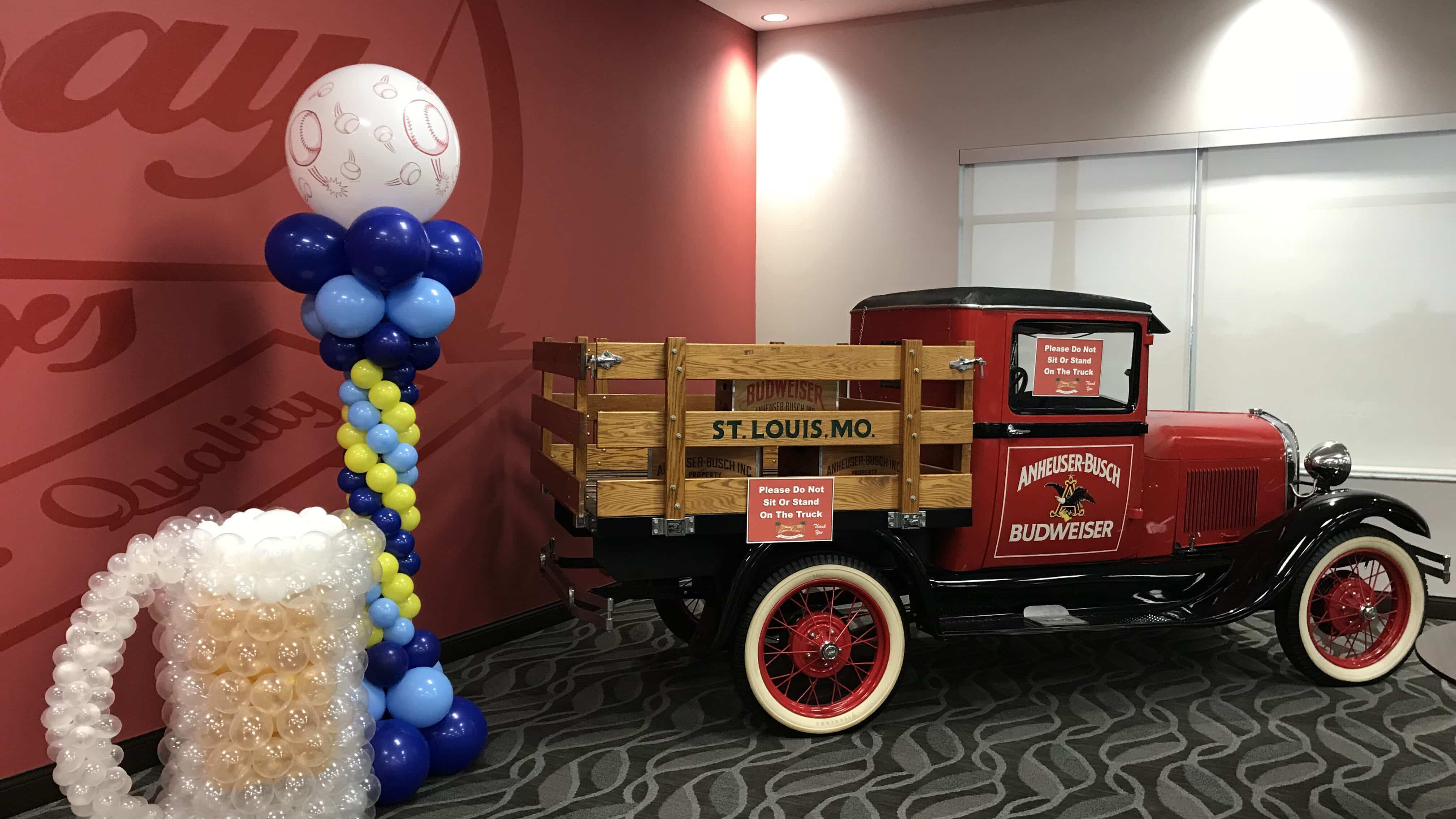 Tampa Budweiser corporate event with beer mug sculpture and balloon column and truck Tampa