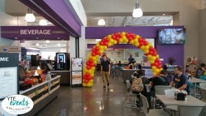 Cafeteria balloon arch for college campus with red and yellow