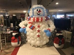 Custom corporate logo balloon sculpture for Macys in Wesley Chapel Florida Snowman sculpture approximately 14 foot tall scaled