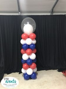 Double stuffed balloon topper on red white blue fourth of july patriotic themed balloon column