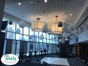 Elegant Ceiling balloon decorations for corporate event at Amalie Arena