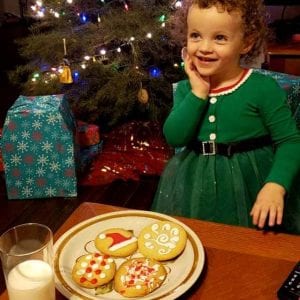 Emmy with milk and cookies christmas
