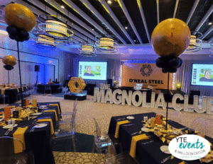 Centerpieces that remotely explode and cascade balloons for a corporate event