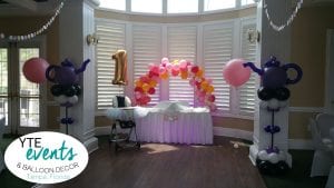 First birthday balloon decor with tea cup columns