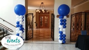 Fun and interesting balloon columns with slow spiral square back bases and blue latex toppers