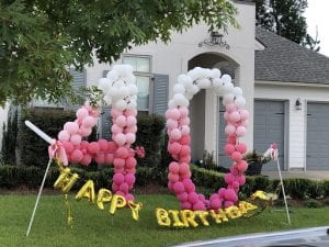 Happy 40th birthday balloon yard decorations after 24 hours in sunlight