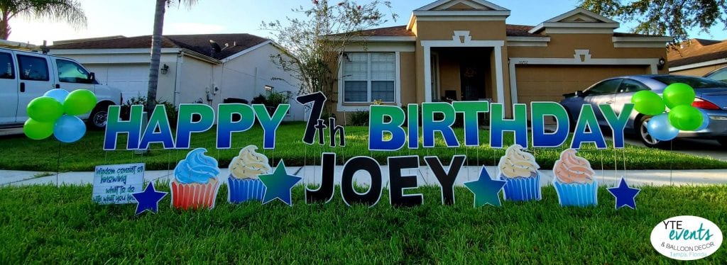Happy Birthday 7th Party Joey Yard Sign cupcakes and green letters