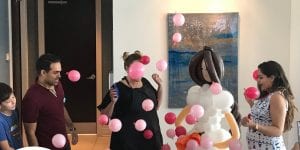 Hosting a gender reveal balloon for a lucky couple