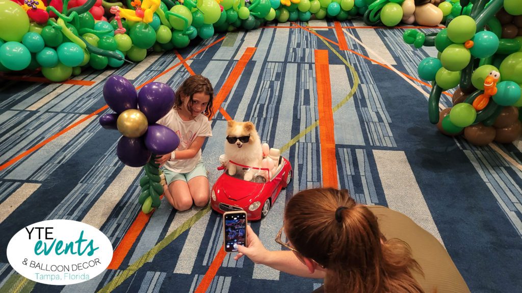 Koda the Fluff enjoying Balloon Wonderland in Orlando Florida with Give Kids the World Village