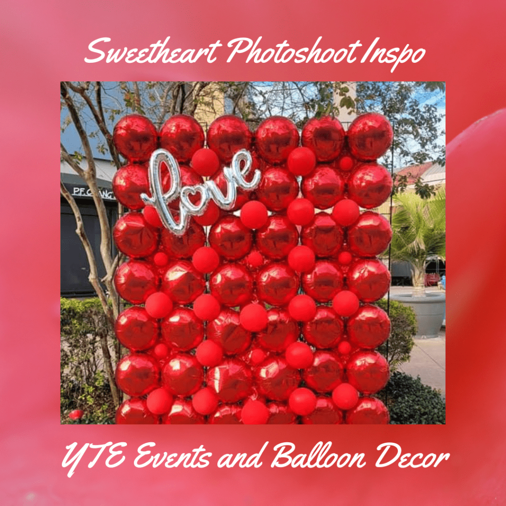 red foil balloon wall with silver "love" balloon