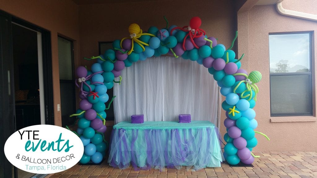 Mermaid colored arch with under sea creatures