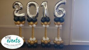 New Years themed columns for event gold black white silver