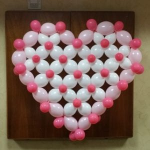 Pink and white balloon heart on wall for decor e1499901027315