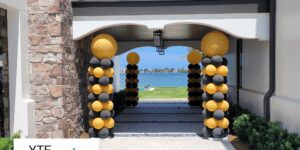 Private graduation event that had yellow and black balloon columns.