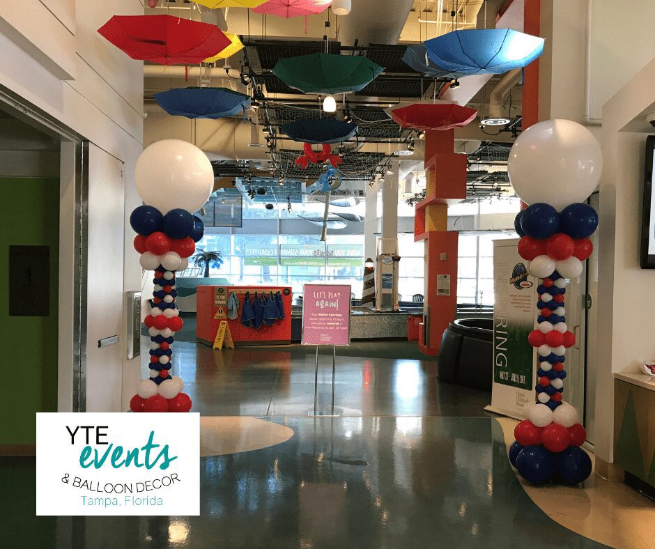 Red white and blue balloon columns for an Independence Day event at the Childrens Museum in Tampa.