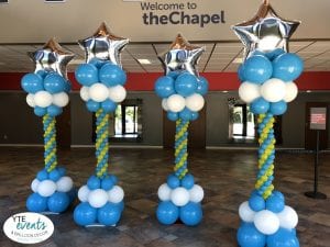 TheChapel Balloon column decorations for special event with blue white silver and yellow decorations