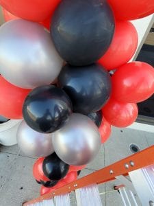 This is what balloon decor looks like from the top of a ladder durring installation scaled