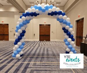 Tri color spiral balloon archway made for a speaking event at the Renaissance Hotel.