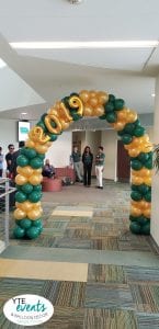 USF green and gold entrance column for graduation event 1