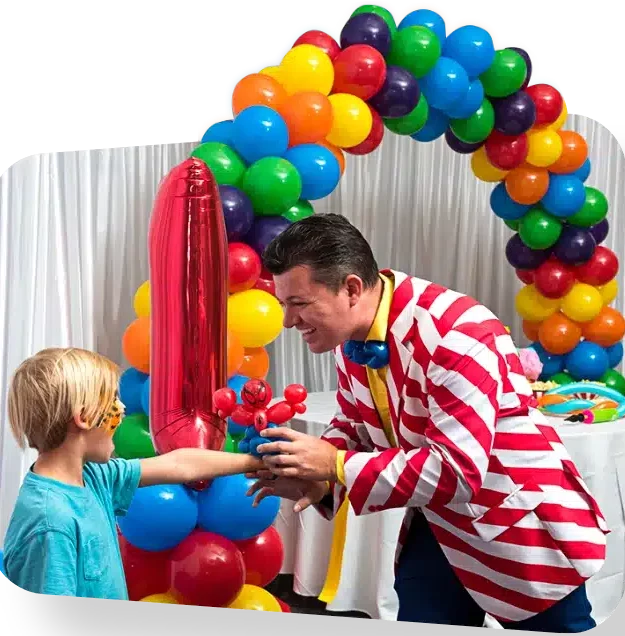 YTE Events and Balloon Decor Home Page Image of balloon twister giving a balloon to child with balloon arch in background