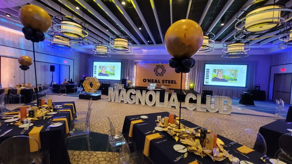 black and gold corporate event with balloon decor centerpieces
