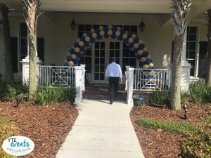 blue and gold balloon arch entrance for graduation event