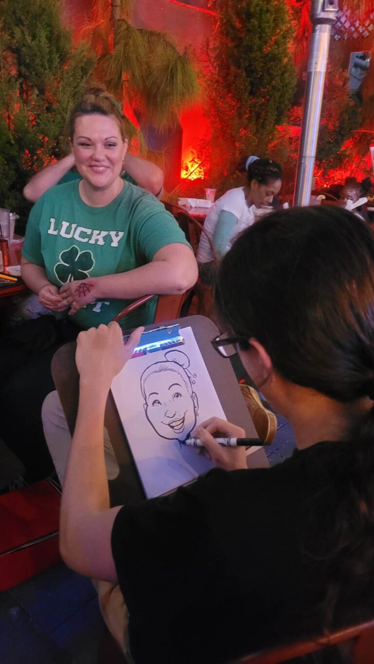 caricature artist sketching in front of woman posing