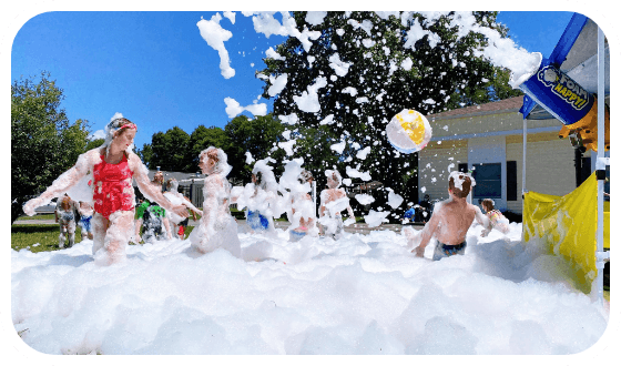 The foam machine casts a spell, transforming the backyard into a whimsical foam wonderland where children embark on adventures filled with giggles.