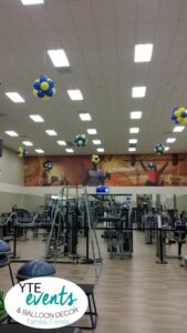 gym balloon decorations on ceiling to greet guests as they workout