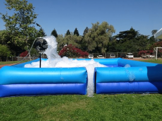 Foam pit inflatable for a foam party, showing foam inside of the pit and how it changes the look of the event and keeps the foam stationary.