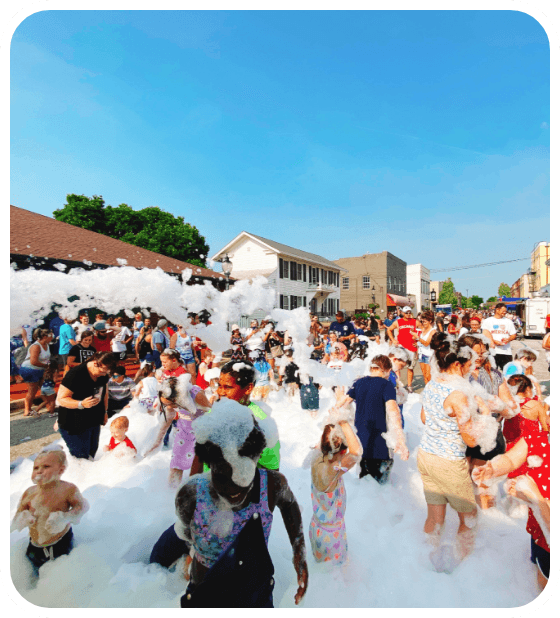 The day’s epitaph written in bubbles, as children relish a frolicsome escapade in a foam-filled utopia, the hallmark of our expertly managed foam parties.