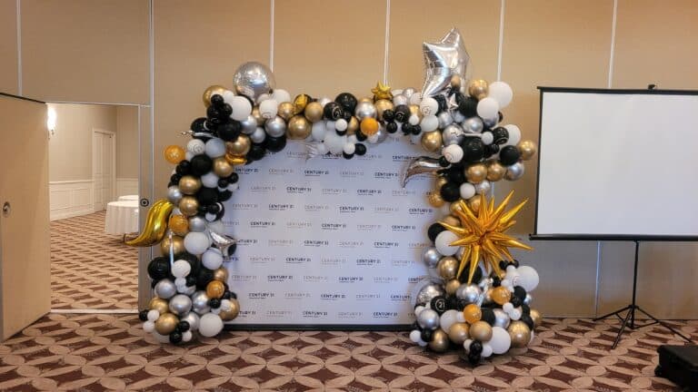 Step and Repeat Backdrop with Elegant Balloon Decor: The Highlight of Your Corporate Awards Ceremony